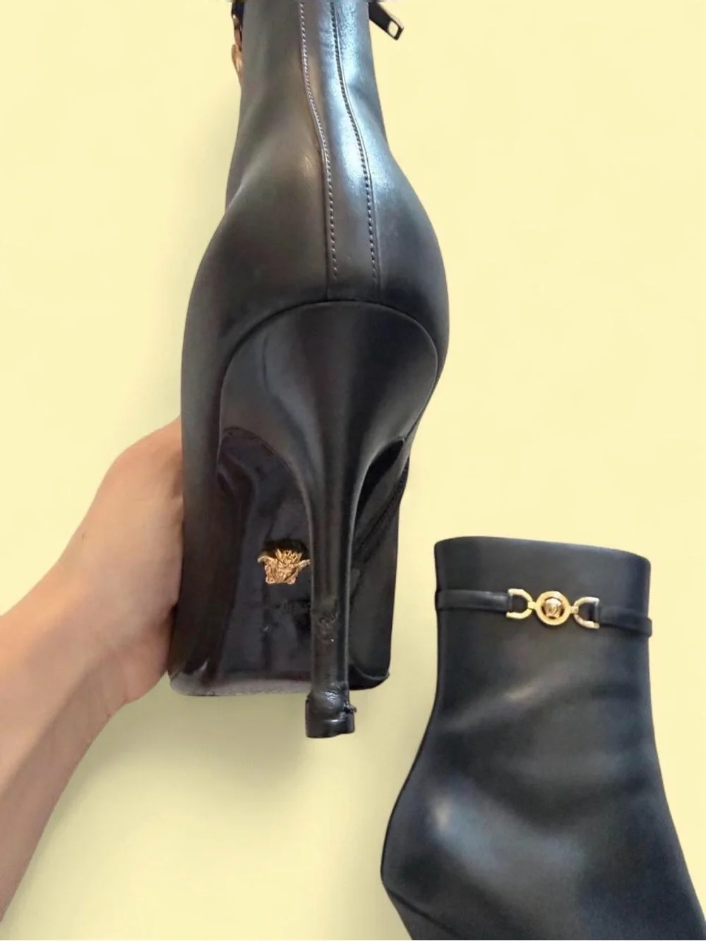 Versace Black Leather Pointed-Toe Stiletto Ankle Boot with Gold Medusa Accent